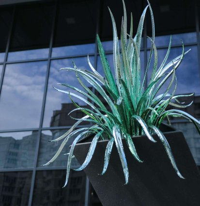 Artificial-Glass-Aloe-Flower-On-A-High-Black-Pedes-2023-04-18-02-41-38-Utc (1)